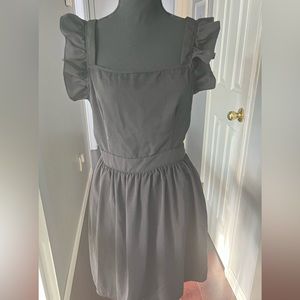 black mini dress. semi open (sexy) back